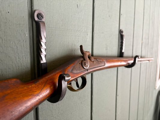 Hand forged rustic iron gun mounting hook. Antique flintlock musket