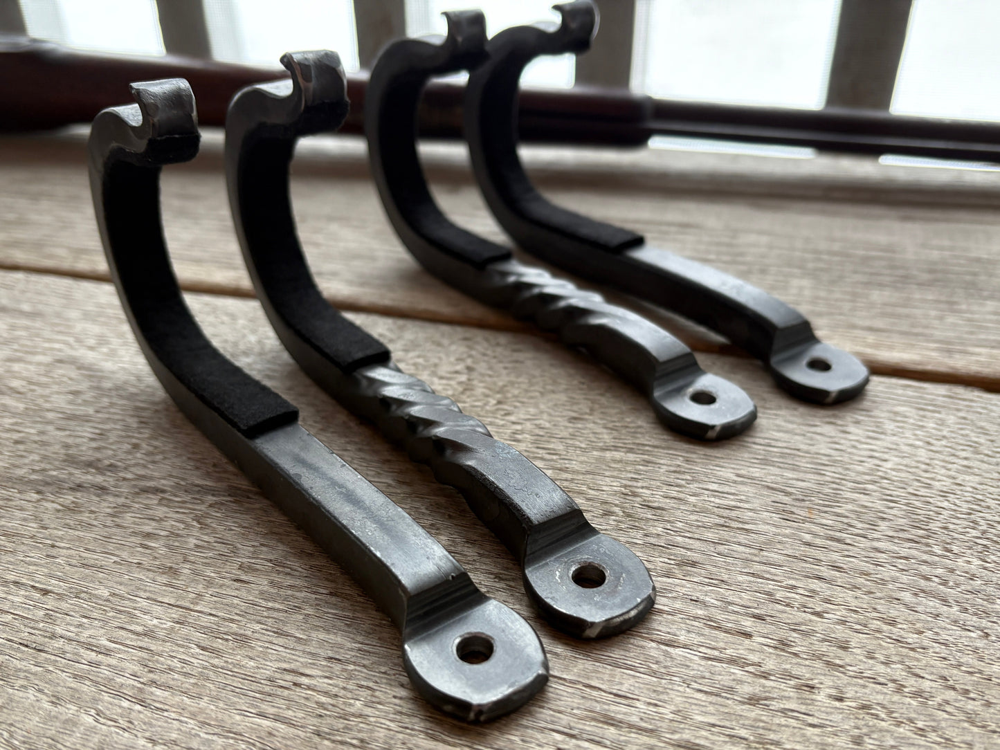 close up of the mounting holes on the rustic gun hooks